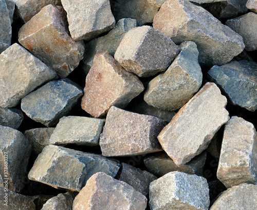 Texture of many coloured large stones, background wallpaper
