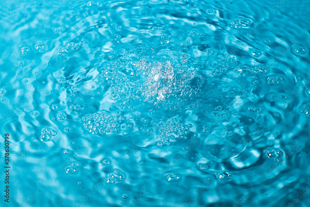 splash of water on a blue background. Abstract wallpaper splash of water on a blue background. Abstract wallpaper