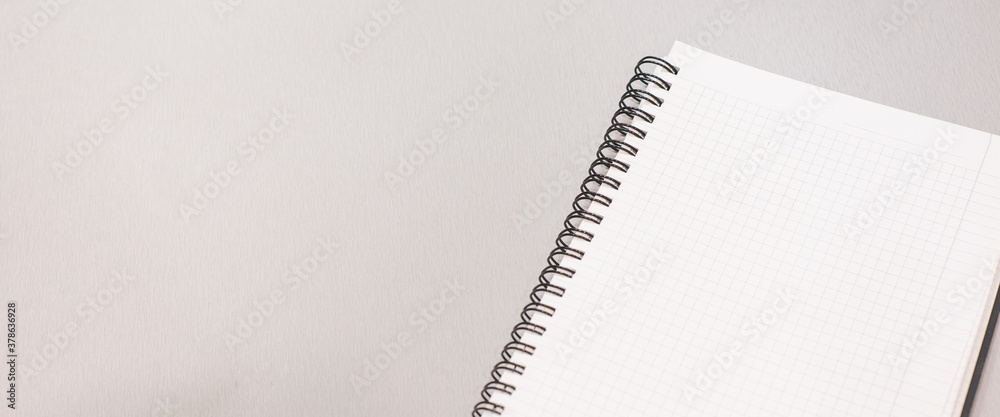 Notepad lie on the gray desktop. Accounting work space Notepad lie on the gray desktop. Accounting work space