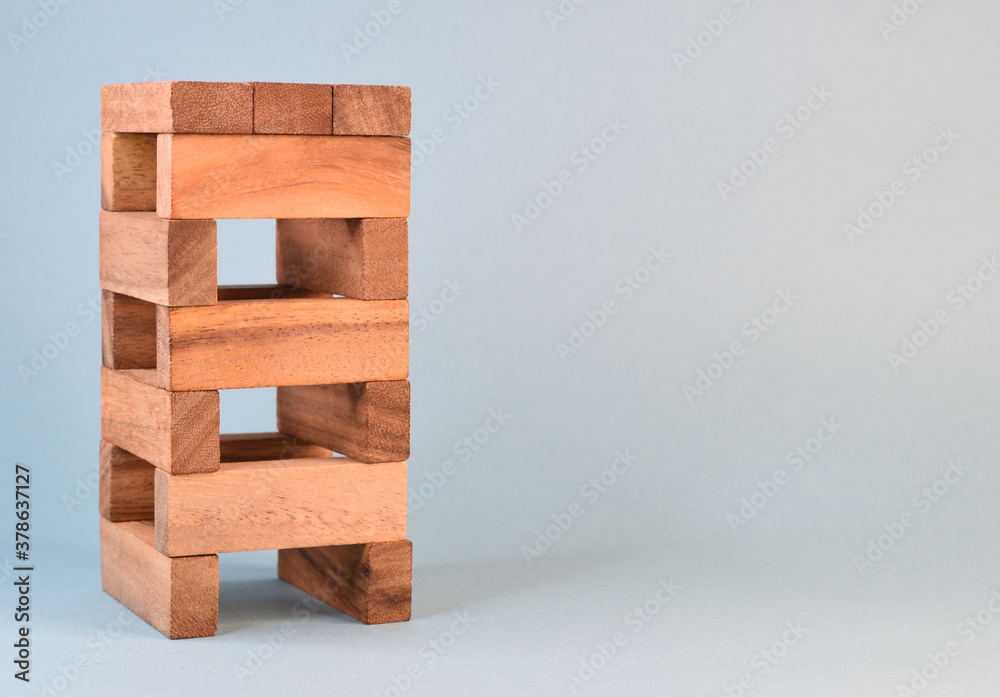 A tower built from wooden toy blocks