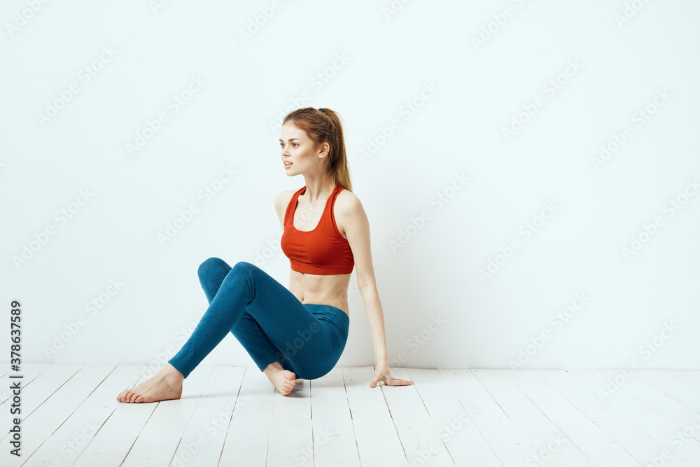 Sportive woman pose gymnastics balance exercise light background Sportive woman pose gymnastics balance exercise light background