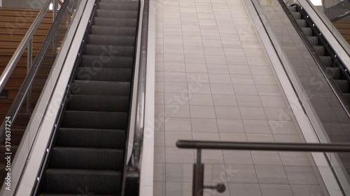 Wallpaper Mural Escalator in empty shopping center mall wide panning shot Torontodigital.ca