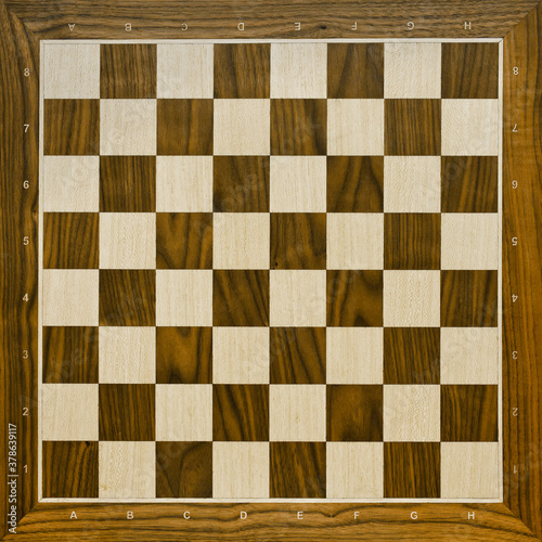 Top view on wooden chess board. Chess game.