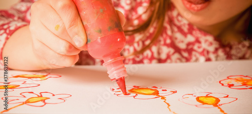 Little cute child girl painting. Creativity, education, child development in art concept. Horizontal image.