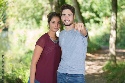 portrait of a romantic couple on forest