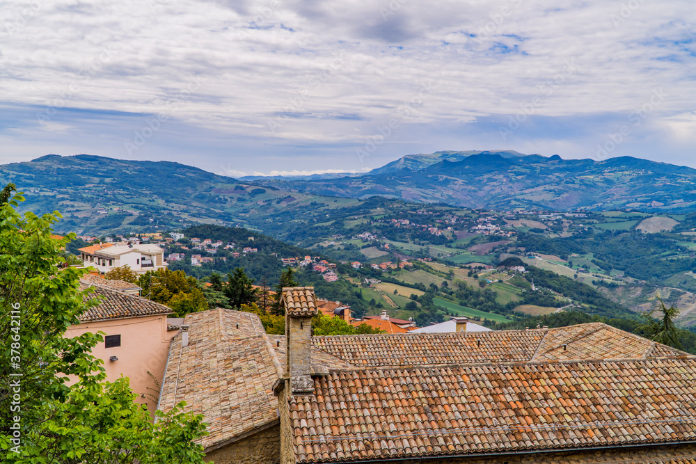 Aerial panoramic view of hills, houses, and landscapes in the Republic of San Marino