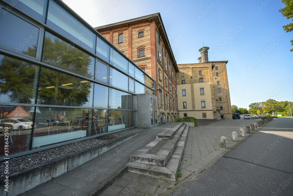 Historic malt factory in Grevesmuehlen, today the building of yellow bricks is an industrial monument and contains some offices of the district administration Northwest Mecklenburg, Germany