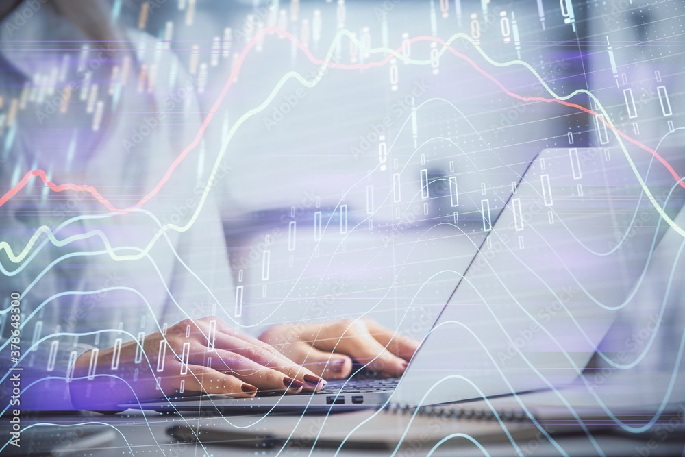 Double exposure of woman hands working on computer and forex graph hologram drawing. Financial analysis concept. Double exposure of woman hands working on computer and forex graph hologram drawing. Financial analysis concept.