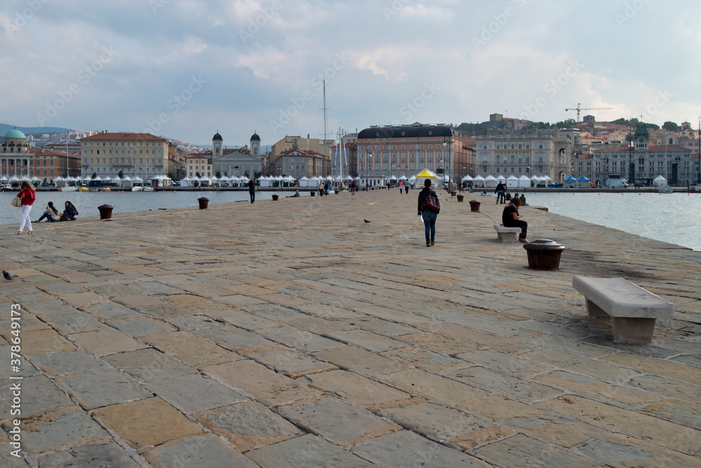 Trieste, Italy - October 07, 2014: City promenade, Trieste sea coast, local architecture