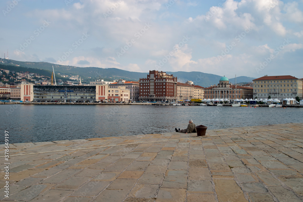 Trieste, Italy - October 07, 2014: City promenade, Trieste sea coast, local architecture