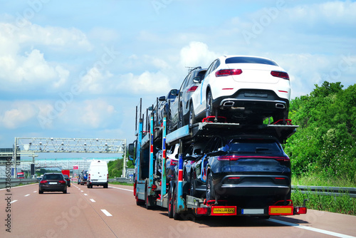 Cars carrier truck transports cars on a highway in Germany. Truck transporter © EKH-Pictures