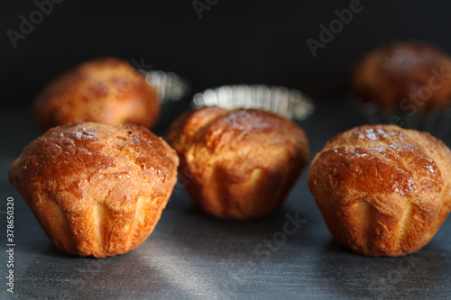 Not sweet muffins for dinner on a black table, with a copy space
