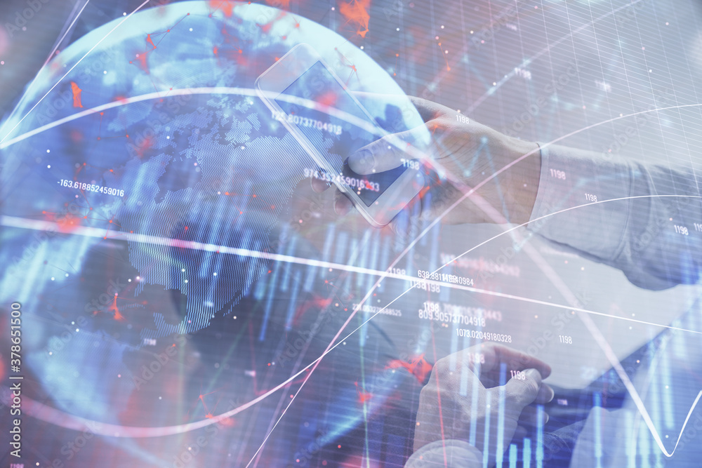 Double exposure of man's hands holding and using a digital device and forex graph drawing. Financial market concept. Double exposure of man's hands holding and using a digital device and forex graph drawing. Financial market concept.