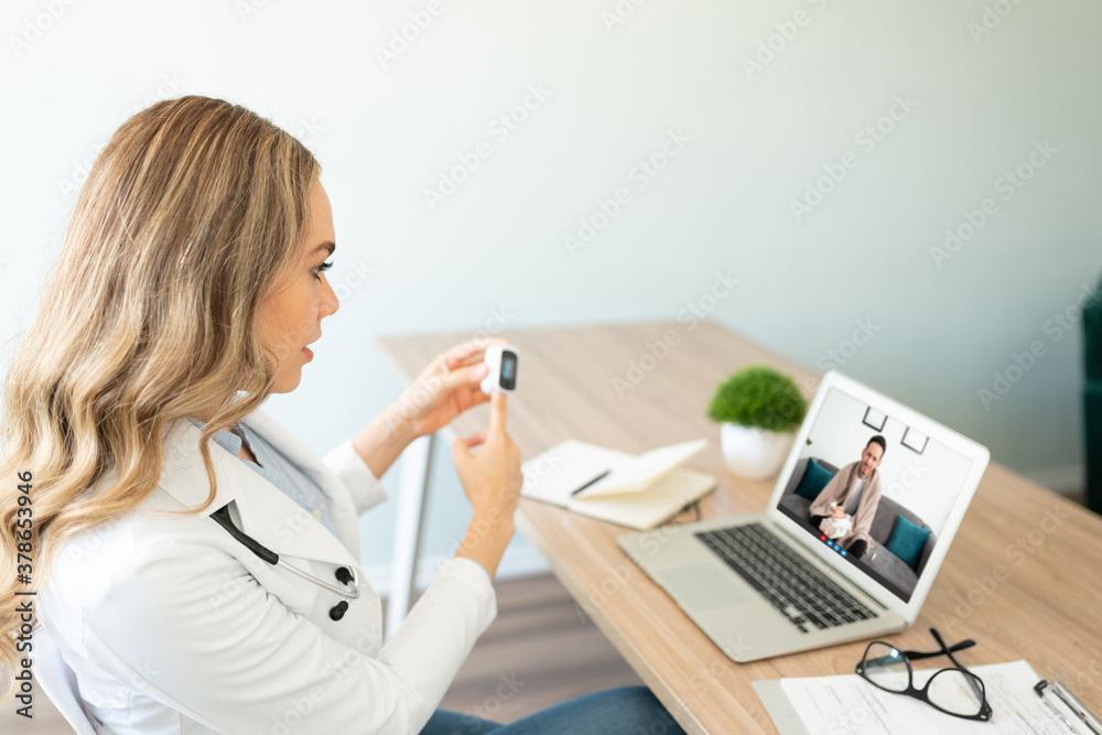 Showing proper use of oximeter on video call Showing proper use of oximeter on video call