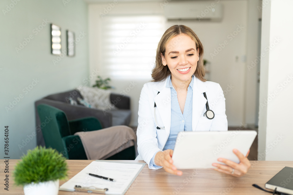 Doctor working from home with a tablet computer Doctor working from home with a tablet computer