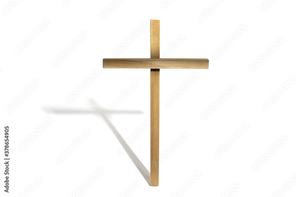 a wooden Easter cross symbol of the Crucificion of Christ with a shadow