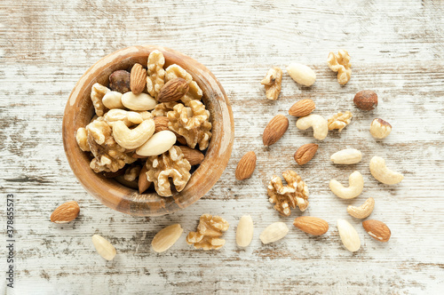 Dry fruits and nuts at wooden table