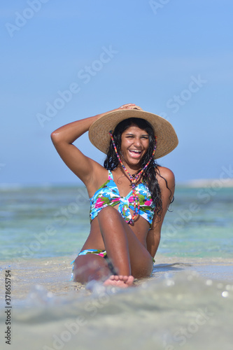 Wallpaper Mural Hispanic happy Woman siting on beach inside water natural laughing Torontodigital.ca