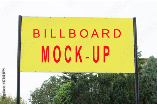 Mockup.Yellow billboard for advertising against the sky. Bright place for your text or ad