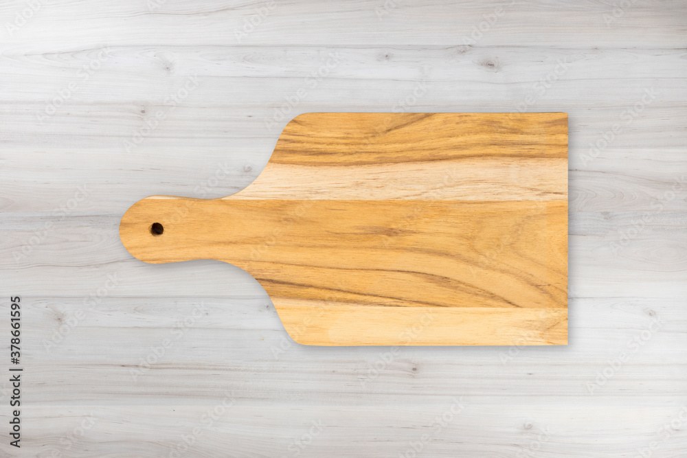 Wooden cutting kitchen Board, isolated on wooden table background. Top view