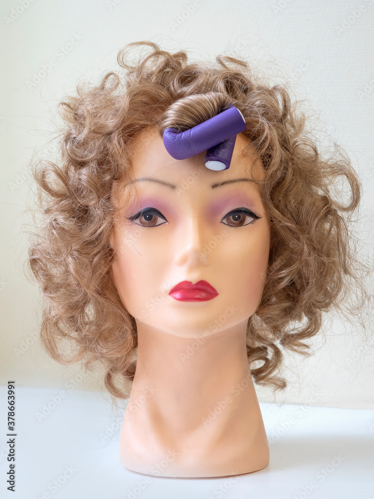 Flexible curlers on the mannequin's head