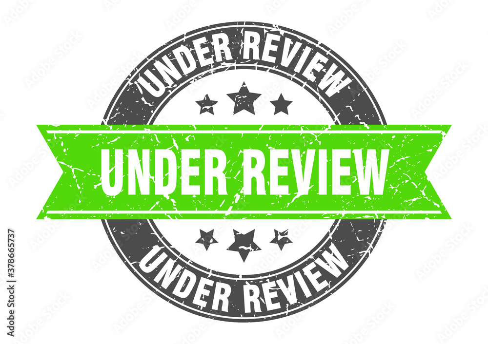 Obraz premium under review round stamp with ribbon. label sign