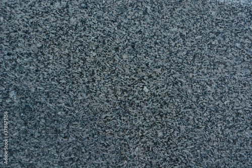 texture of a gray-black granite slab made of crumbs; abstract granite texture for design