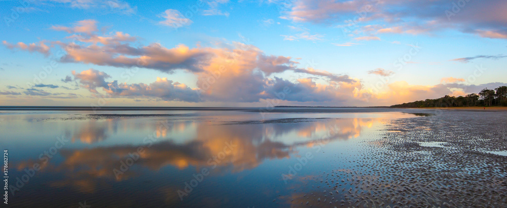 Dundowran Beach sunset with cloud reflections. Queensland, Australia