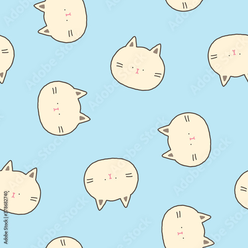 Seamless Pattern of Cute Catoon Cat Face Design on Light Blue Background