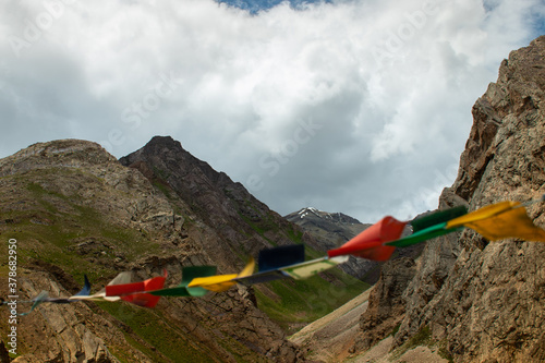 mountains clouds and the flag