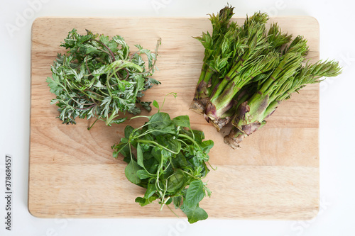 spring vegetables on cutting board