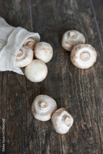 white mushrooms on wooden table