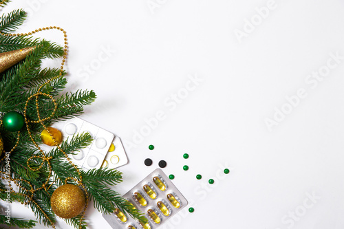 Medical banner with xmas decoratoin and pills on white background. Copy space, medicine greeting card, top view