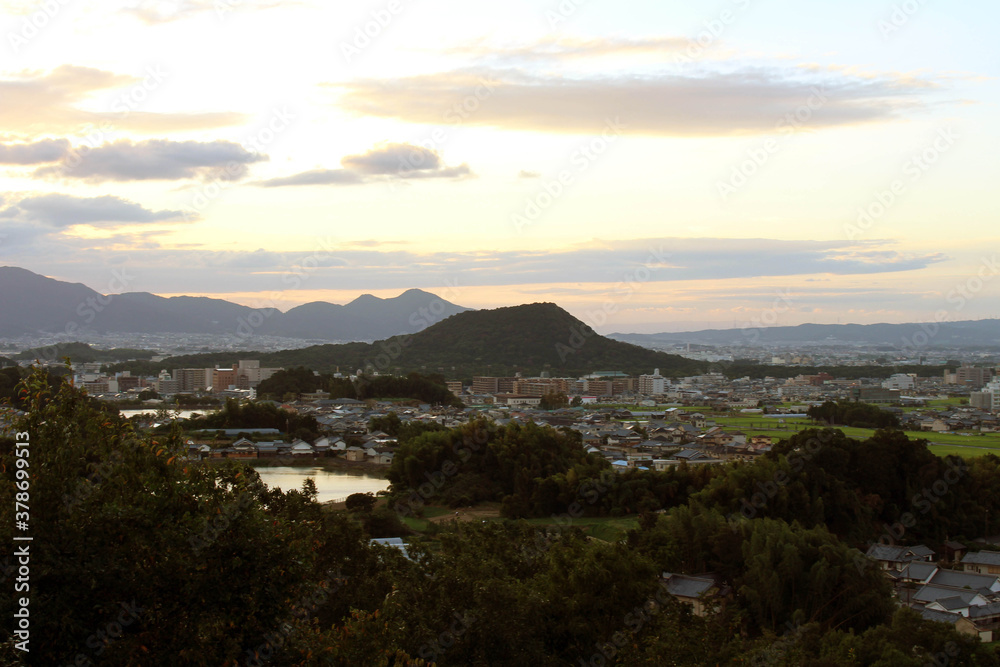 Asuka town in Nara as seen from Amakashi no Oka Observatory hill during sunset