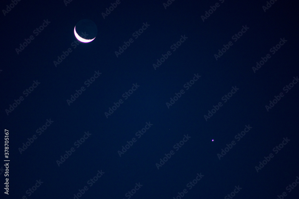 Celestial conjunction of a crescent Moon and the planet Venus Celestial conjunction of a crescent Moon and the planet Venus
