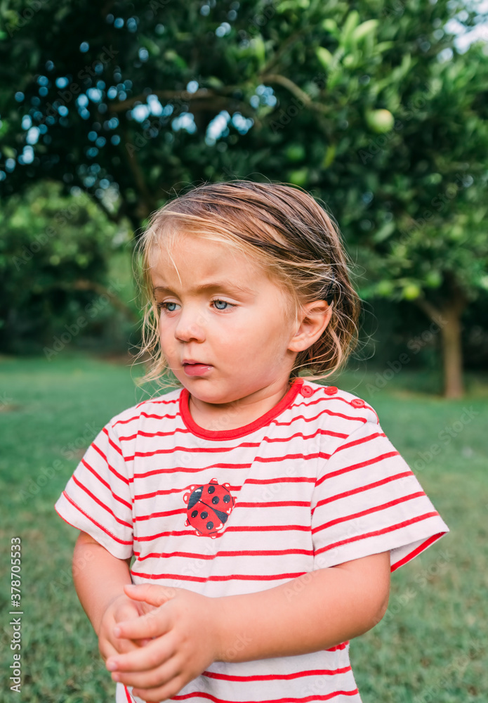 Toddler girl portrait in garden Toddler girl portrait in garden