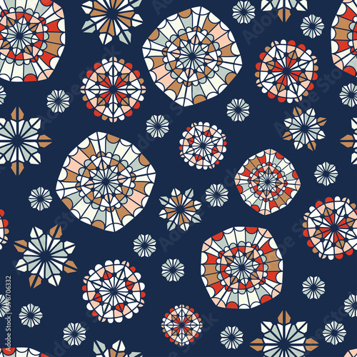 Seamless vector pattern of ornamental lined abstract flower snowflakes on blue