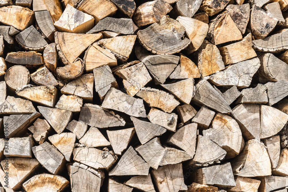 Stacked wood wooden logs firewood, textured background Stacked wood wooden logs firewood, textured background