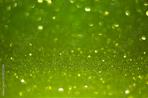 Abstract Green bokeh defocus glitter yellow Background.