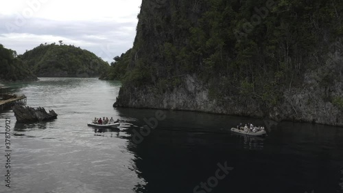 Raja Ampat, Misool, Palau Karawapop, Geosite, Love Lake Misool.  Dinghy approaches Geosite Karawapop sign.