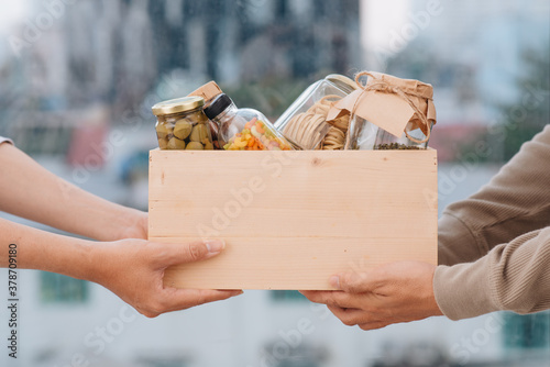 Fotótapéta Volunteers with donation box with foodstuffs