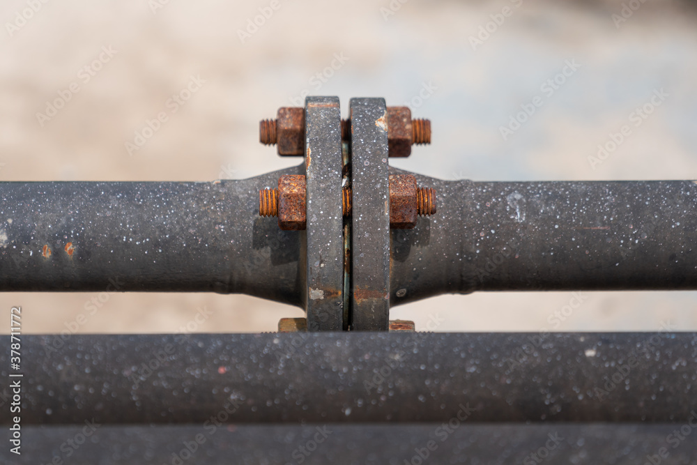 Close-up at connection flange of fluid pipeline in chemical plant. Industrial equipment photo. Close-up at connection flange of fluid pipeline in chemical plant. Industrial equipment photo.