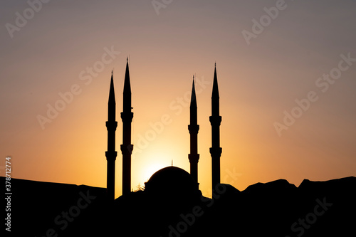 The aesthetic architectural image of the minarets in a magnificent sunrise