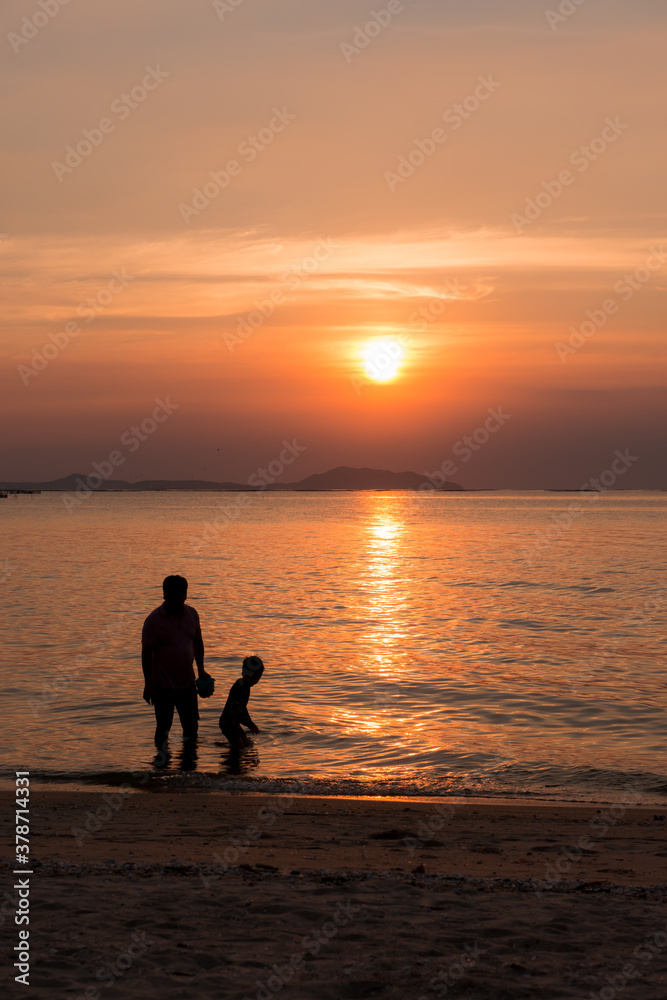 parent and child at the beach