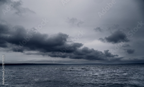 dark stormy sea and dramatic clouds, gloomy nature © soleg