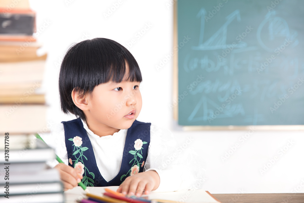 Chinese little girl studying in the classroom