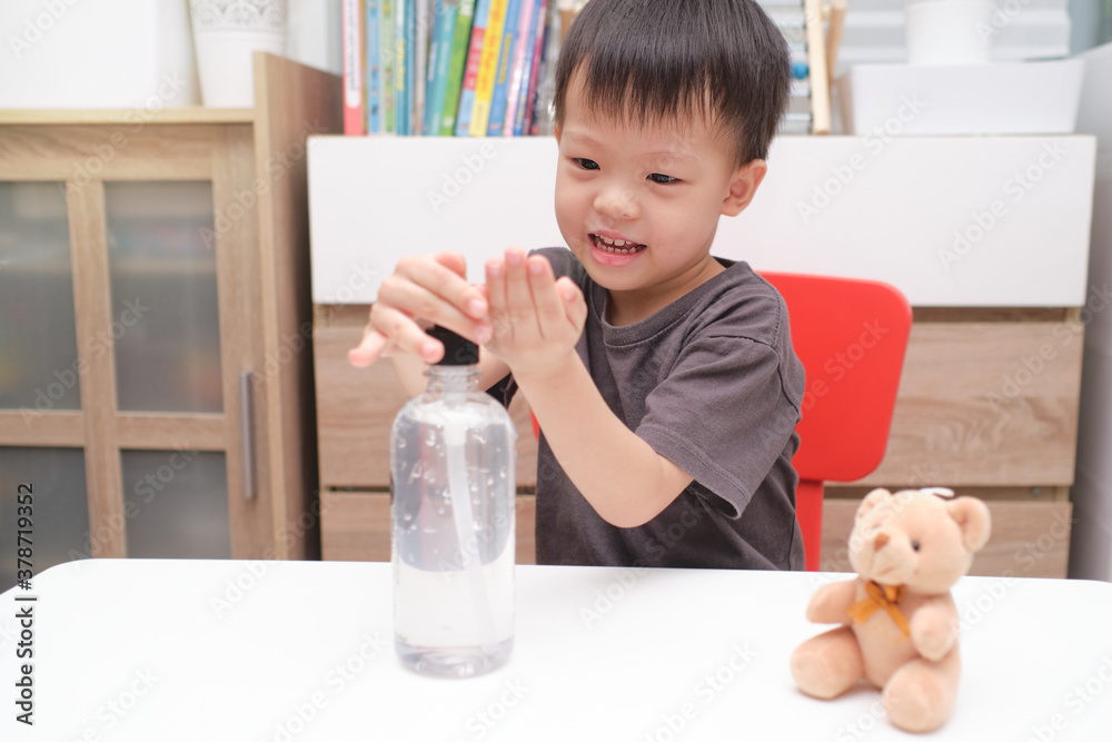 Asian boy using antibacterial hand sanitizer gel on hands, Little kid applying alcohol hand gel by himself during Covid-19 health crisis, Virus & illness protection, New normal lifestyle concept Asian boy using antibacterial hand sanitizer gel on hands, Little kid applying alcohol hand gel by himself during Covid-19 health crisis, Virus & illness protection, New normal lifestyle concept