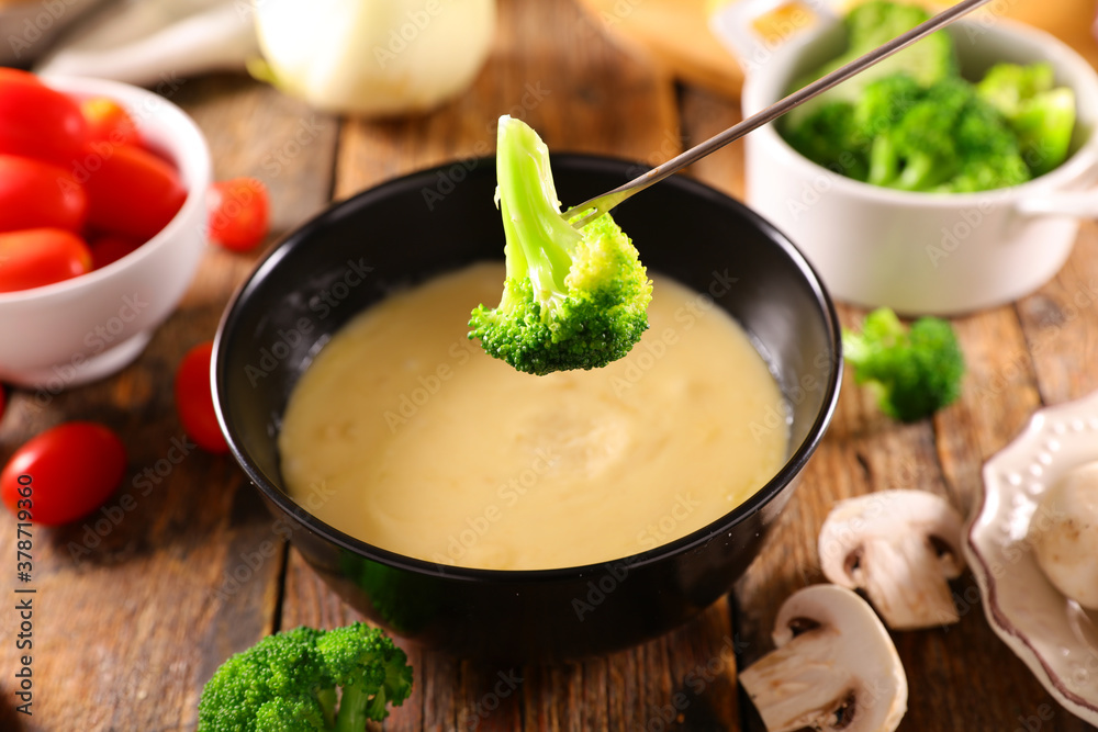 cheese fondue with fresh vegetable- broccoli, tomato, potato and mushroom cheese fondue with fresh vegetable- broccoli, tomato, potato and mushroom