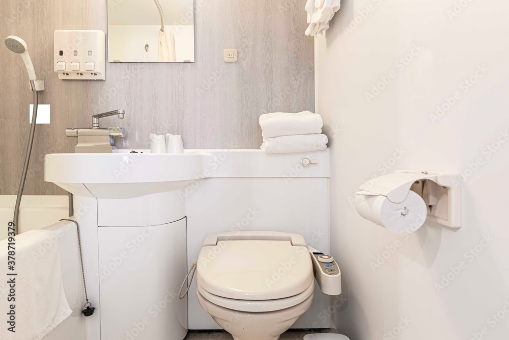Modern automatic toilet In a small toilet in a wooden house Modern automatic toilet In a small toilet in a wooden house