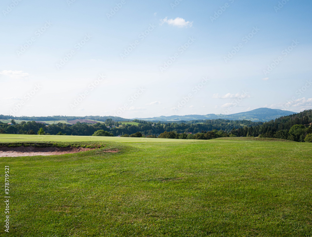 landscape with green grass and sky golf field